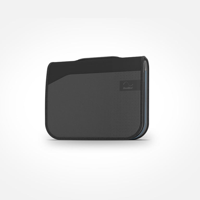 ResMed Autoset Carry bag that comes with a purchase of the CPAP Machine.  The bag is dark grey and is closed, on the white background